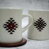 Close Up View Of The Red & Brown Out Yonder Mugs